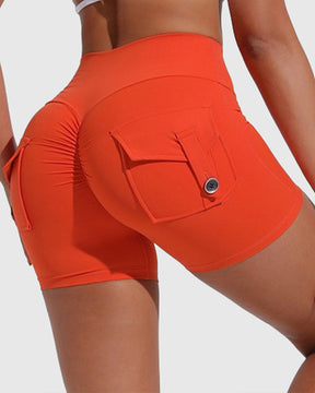 Pantalones cortos de yoga para mujer con bolsillos traseros tipo cargo y levantamiento de cadera