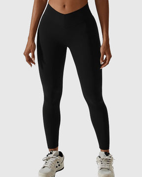 Leggings plisados ​​con costura en forma de V que moldean el cuerpo Pantalones de yoga para levantamiento de glúteos