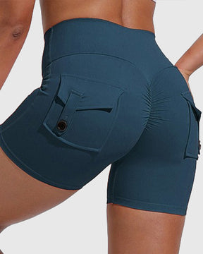 Pantalones cortos de yoga para mujer con bolsillos traseros tipo cargo y levantamiento de cadera