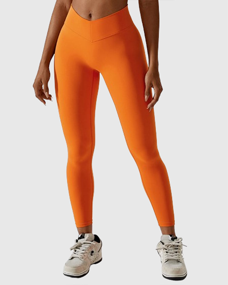 Leggings plisados ​​con costura en forma de V que moldean el cuerpo Pantalones de yoga para levantamiento de glúteos