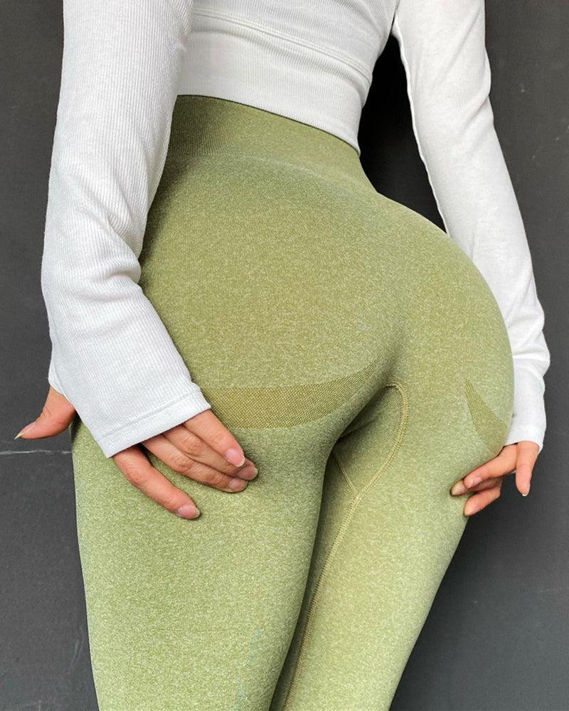 Pantalones de yoga elásticos de cintura alta para fitness con levantamiento de glúteos y cara sonriente sin costuras